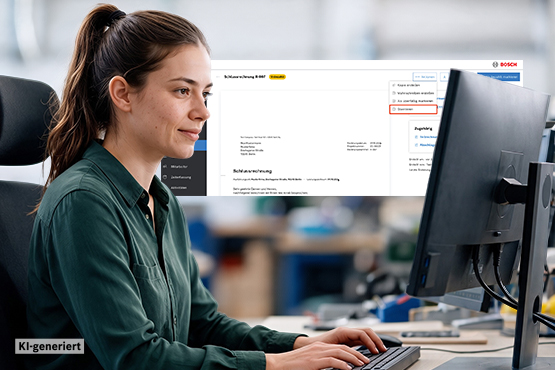 Eine Frau mit langen, braunen Haaren sitzt an einem Schreibtisch und arbeitet am Computer. Der Bildschirm zeigt eine Website von Bosch mit Informationen und einem Logo. Die Umgebung ist hell und modern, mit Werkzeugen und Materialien im Hintergrund. Die Frau trägt ein dunkelgrünes Hemd und wirkt konzentriert. (250 Zeichen)